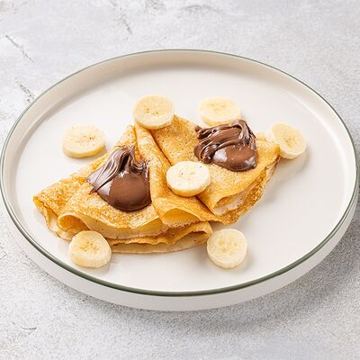 Блинчики с бананом и пастой Нутелла в Шоколадница по цене 390 ₽