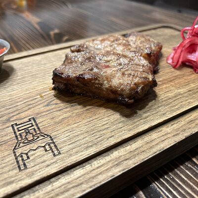 Стейк из свиной шеи в Бардак Бар по цене 580 ₽