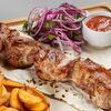 Шашлык из свиной шеив Два хинкали и пельмень по цене 580