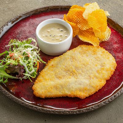 Куриный шницель с грибным соусом в Русская рыбалка по цене 980 ₽