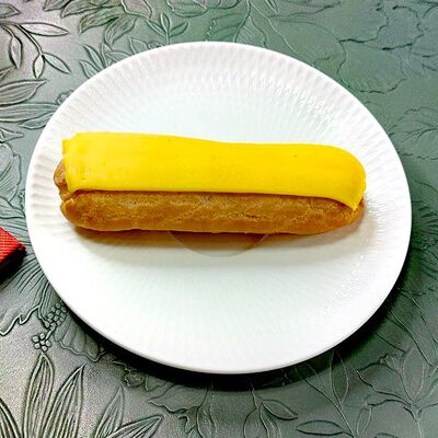 Манговый эклер в La Vida loca по цене 250 ₽