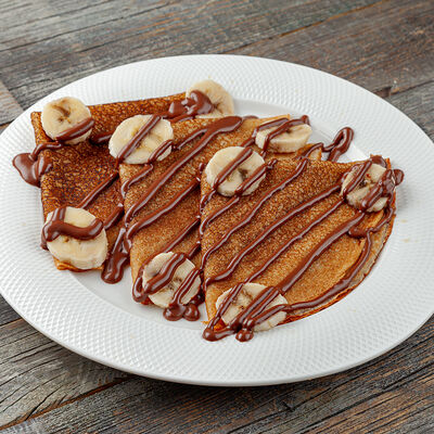 Блин с бананом и нутеллой в Трапезная по цене 440 ₽