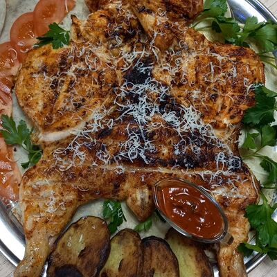 Фирменная курица в У Цоло по цене 1460 ₽