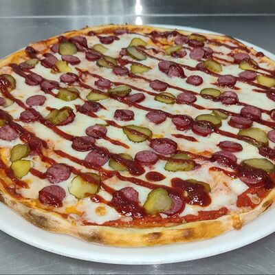 Пицца с охотничьими колбасками в Pizza House по цене 890 ₽