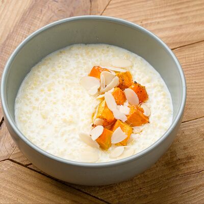 Пшенная каша с печеной тыквой и мёдомв Debaton по цене 375 ₽