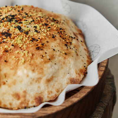 Лепешка с кунжутом и фисташками в Folk по цене 350 ₽