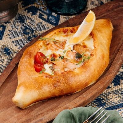 Хачапури по-аджарски с форелью в ШБ Next по цене 610 ₽