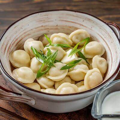 Пельмени со сметаной и масломв Гастробар Феллини по цене 360 ₽