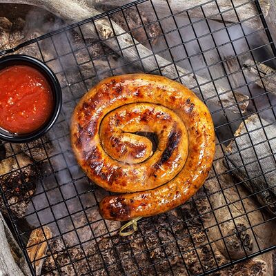 Жареная свиная колбаска с гарниром в 7 небо по цене 540 ₽