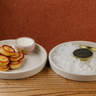 Оладушки с черной икрой в Sunny cafe по цене 3910 ₽