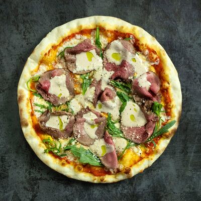 Пицца с телятиной и рукколой 30 см в Остерия Il Massimo по цене 890 ₽