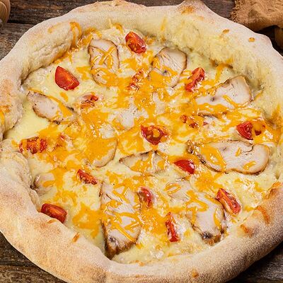 Сливочный цыпленок пицца в Дом пиццы по цене 1100 ₽