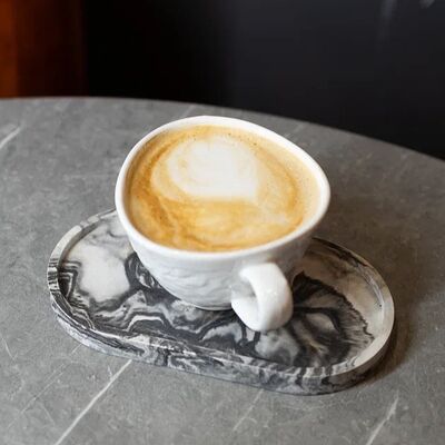 Большой капучино в Scrooge по цене 290 ₽