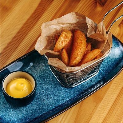 Картофель по-деревенски в Наше место по цене 290 ₽