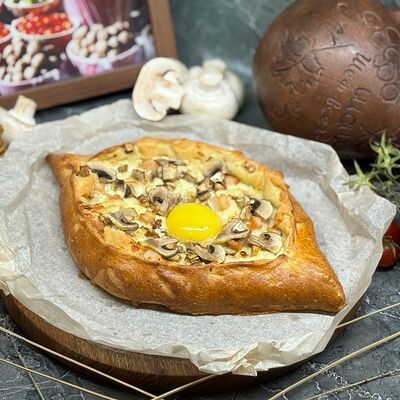 Хачапури по-аджарски с курицей и грибами в Мангал & Гриль по цене 590 ₽