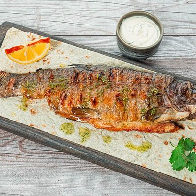 Форель радужная на мангале в Yunga Tim Fish & Grill по цене 1870 ₽