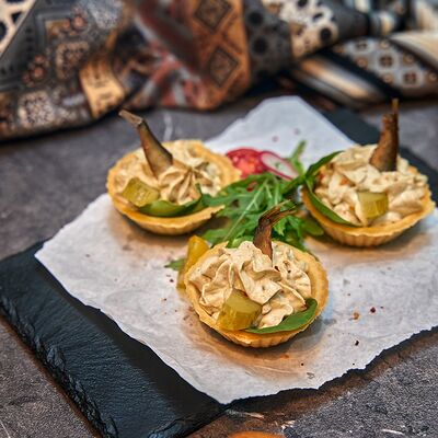 Тарталетка со шпротами в IKRA по цене 425 ₽