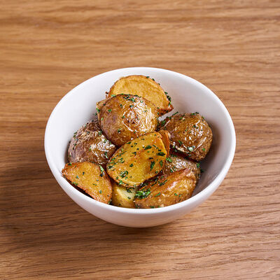 Картофель мини с чесноком и петрушкой в Клёво по цене 250 ₽