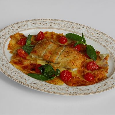Палтус, запеченный в печи с пармезаном, картофелем и помидорами в Bistrot по цене 3300 ₽