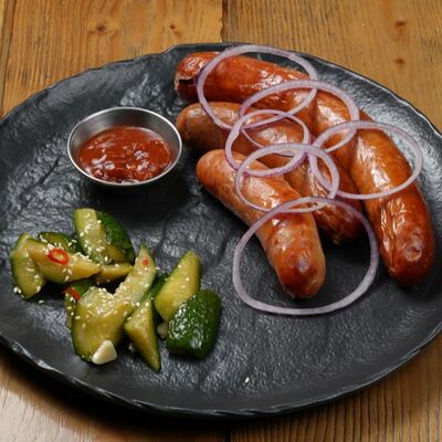 Ассорти колбас с аджикой и битыми огурцами в Brasserie Kriek по цене 1590 ₽