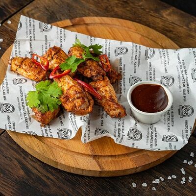 Куриные крылья на открытом огне в Мангал по цене 310 ₽