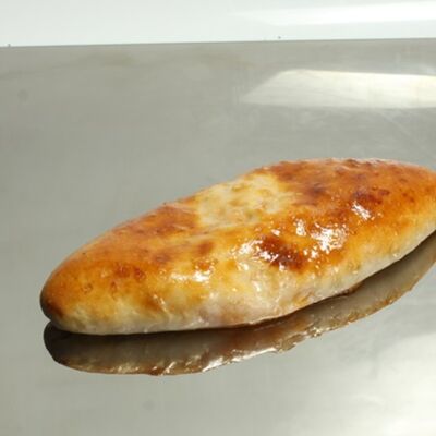 Осетинский пирог с сыром и зеленью в Хлебный двор по цене 195 ₽