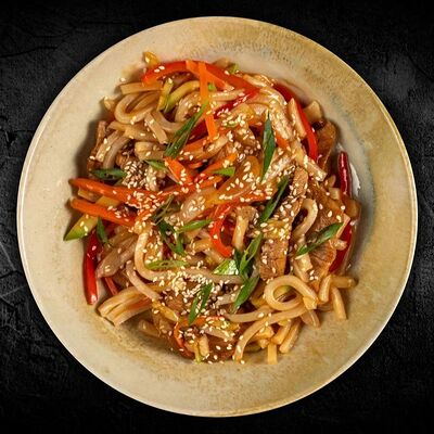 Wok со свининой в кисло-сладком соусе в Голодный WOK по цене 520 ₽