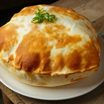 Наан пшеничная с маслом гхи в Джимми Чу по цене 320 ₽