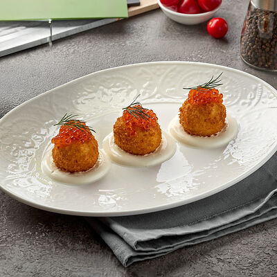 Картофельные крокетыс красной икрой и сметаной в Lava по цене 540 ₽