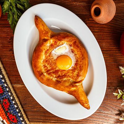 Хачапури по-аджарски двойной в Хинкальня по цене 33 р.