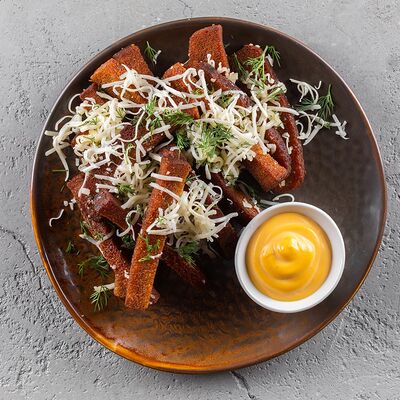 Ржаные гренки с сыром в Мангал по цене 220 ₽