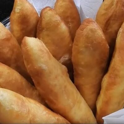 Пирожок с яйцом, зеленым луком и рисом в Шаломня по цене 70 ₽