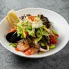 Теплый салат из морепродуктов в Japan Corner по цене 1450