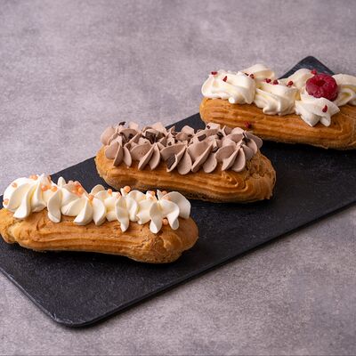 Набор эклеров в Фабрика чизкейков по цене 450 ₽