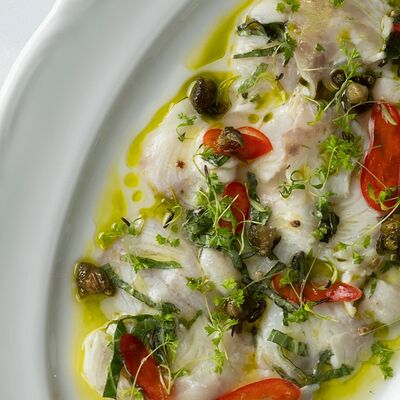 Крудо из сибаса с базиликом в Brera по цене 1050 ₽