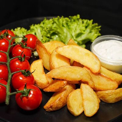 Картофель по-деревенски в Мангал Кебаб по цене 270 ₽