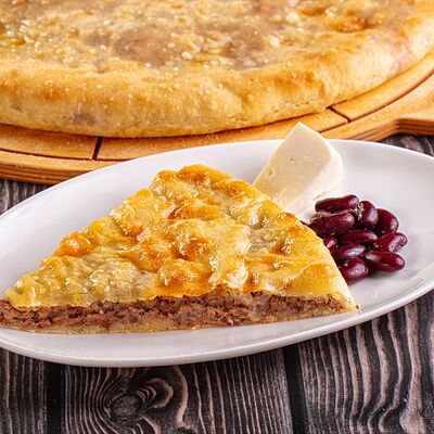 Пирог с фасолью и сыромв Осетинские Пироги по цене 1200 ₽