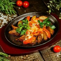 Сковородка со свининой в Кус-кус