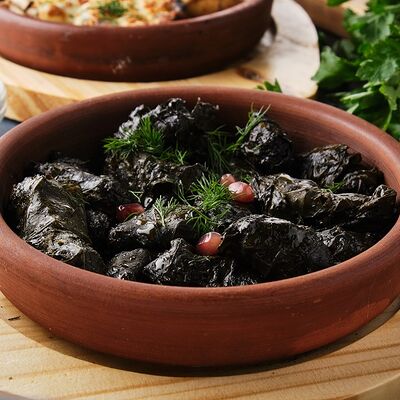 Долма из виноградных листьев в Mangal House по цене 460 ₽