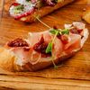 Брускетта с сыровяленой свининой в Лебовски Пицца и Боулинг по цене 240