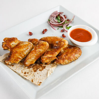 Шашлык из куриных крыльев в Мангал-House по цене 360 ₽