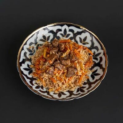 Плов узбекский в Чайхана Айва по цене 560 ₽