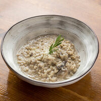 Ризотто с трюфельным кремом и шампиньонами в Perbacco Italian Restobar