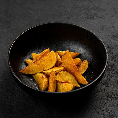 Картошка по-деревенски в Гриль бар Решётка по цене 205 ₽