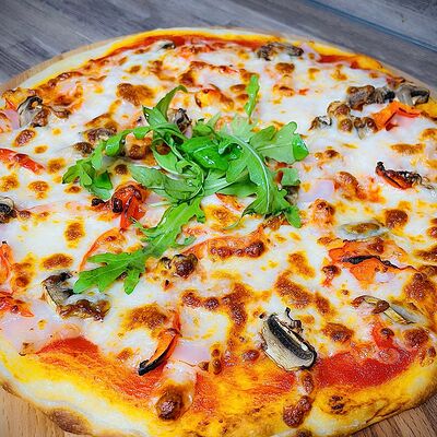 Пицца Ассорти в Caramel по цене 735 ₽