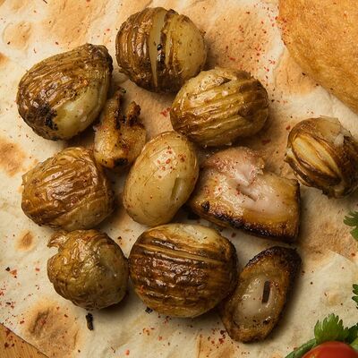 Картошка с курдюком на мангале в Гурман студия по цене 350 ₽