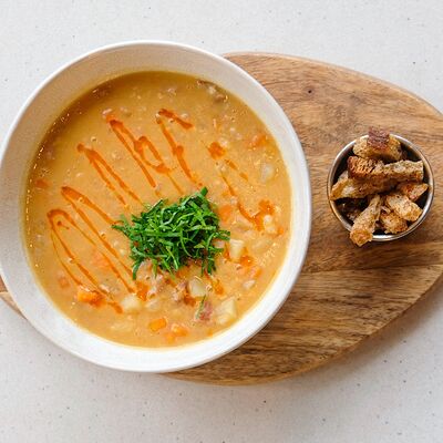 Гороховый суп с копченостями в МОСТ бистро по цене 650 ₽