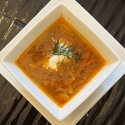 Щи с квашенной капустой, филе птицы и сметаной в Длинный нос по цене 210 ₽