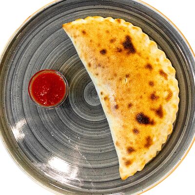 Кальцоне с ветчиной и грибами в Шпитса пицца по цене 330 ₽