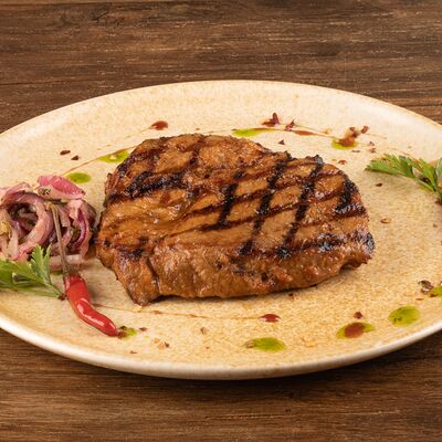 Стейк из свиной шеи в El sol по цене 700 ₽